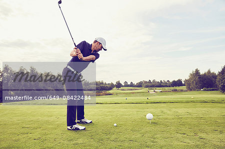 Golfer playing golf on course, Korschenbroich, Dusseldorf, Germany