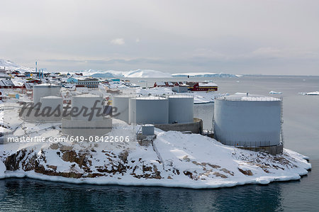 Elevated view of snow covered oil tanks at Ilulissat, Greenland