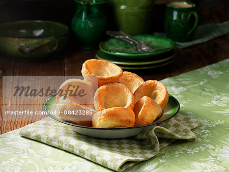 Bowl of yorkshire pudding with green colour pottery