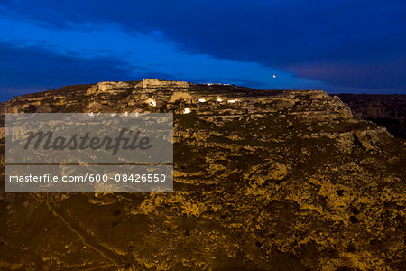Overview of the Sassi of Matera, in the Murgia of Matera Park, with ancient cave dwellings and rock churches at night, Matera, Basilicata, Italy
