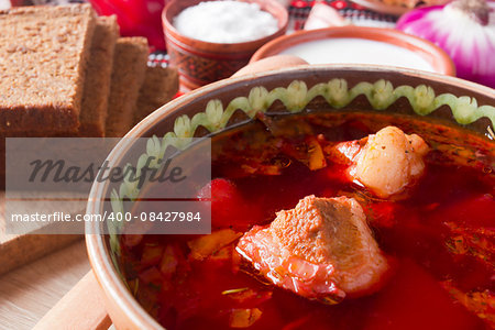 The pieces of meat in the borscht soup as the main ingredient of this dish.