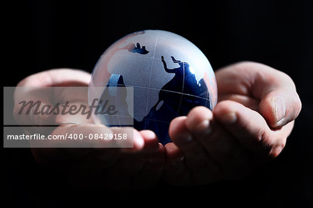 glass globe in hand