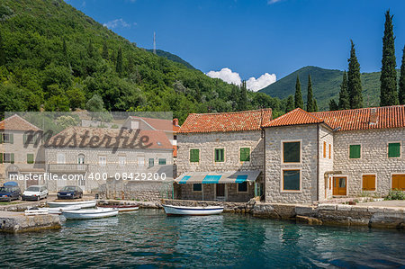 Montenegrian traditional style fisherman's village with wooden boats. Touristic places of Montenegro.