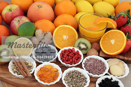 Large super food fruit selection with herbs, spices and supplement capsules for cold and flu remedy including foods high in antioxidants and vitamin c.