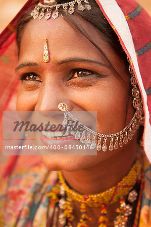 Portrait of Traditional Indian woman in sari costume covered her head with veil, India