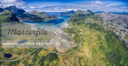 Aerial panorama of scenic road around fjord on Lofoten islands in Norway, one of the most beautiful roadtrips in the world