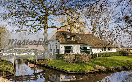 Old white farm in historical village Giethoorn, Holland