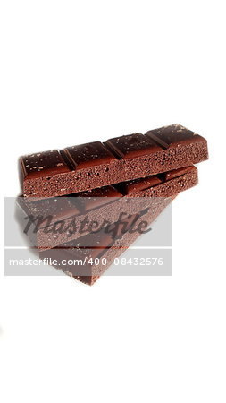 Porous chocolate in stack on a white background closeup