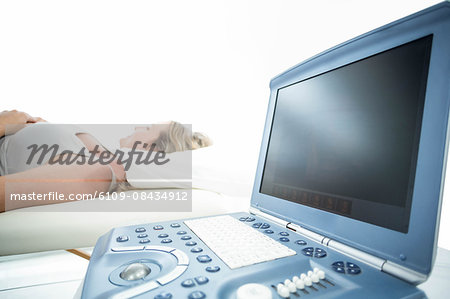 Pregnant woman receiving ultrasound treatment in hospital