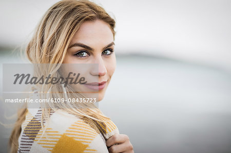 Beautiful blonde woman relaxing in the coastline