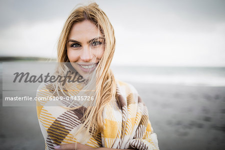 Beautiful blonde woman relaxing in the coastline