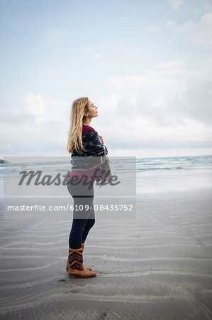 Beautiful blonde woman relaxing in the coastline