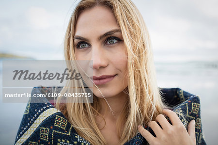 Beautiful blonde woman relaxing in the coastline