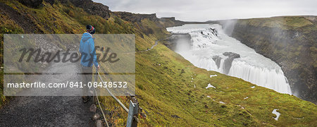 Tourist at Gullfoss Waterfall in the canyon of the Hvita River, The Golden Circle, Iceland, Polar Regions