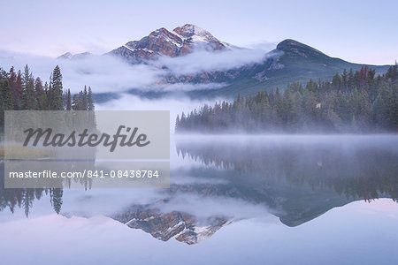 A misty Pyramid Mountain reflected in Pyramid Lake at dawn, Jasper National Park, Canadian Rockies, UNESCO World Heritage Site, Alberta, Canada, North America