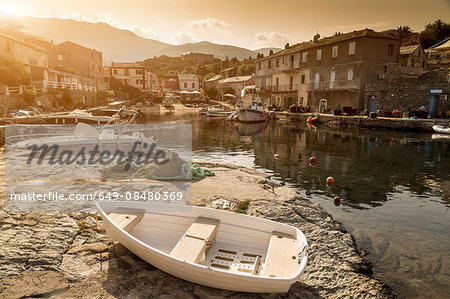 Fishing boats moored in traditional harbour, Centuri, Corsica, France