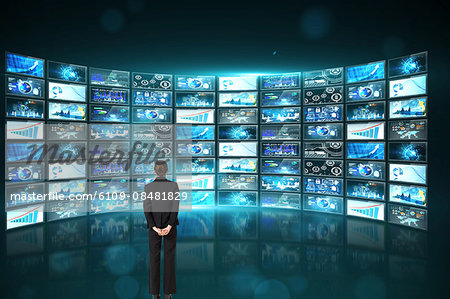 Businesswoman looking at data on screen
