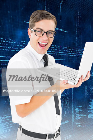Businessman holding laptop on digital background