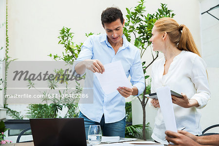 Business professionals reviewing documents