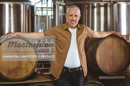 Happy brewer looking at camera at the local brewery