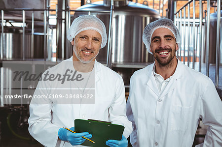 Team of brewers working together at the local brewery