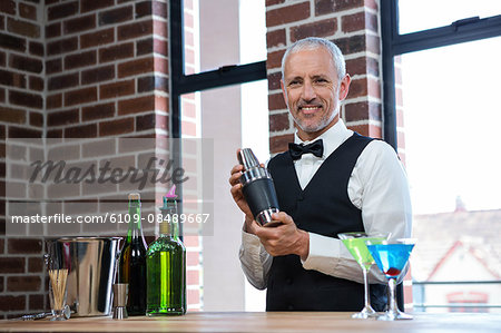 Barman preparing a cocktail in a pub