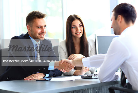 Business people shaking hands, finishing up a meeting