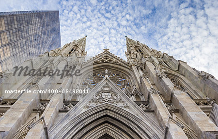 Front of St. Patricks Cathedral and a skyscraper in New York City, USA