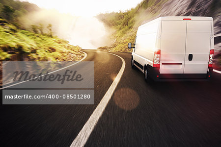 Truck on road in a natural landscape