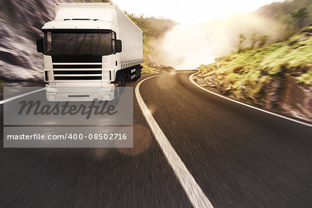 Truck on road in a natural landscape