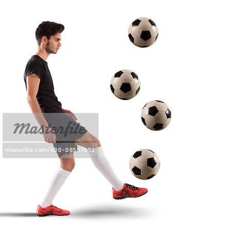 Teenage soccer player dribbling with four soccerball