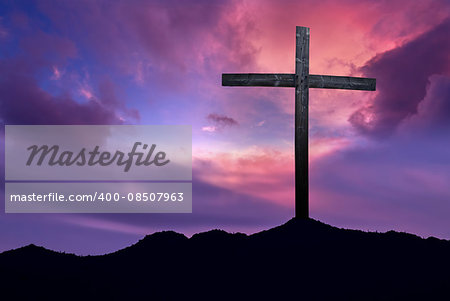 Silhouette of Christian cross at sunrise or sunset concept of religion