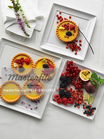 Tartlets with berries on a square plate
