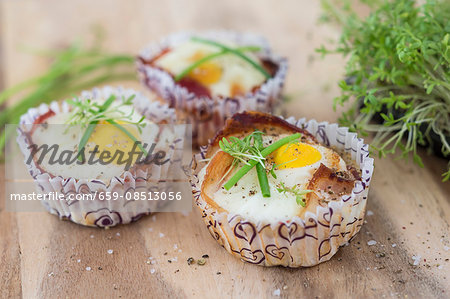 Baked eggs with bacon in paper cases