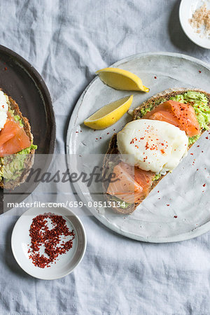 Bread with avocado, smoked salmon and poached egg Bread with avocado, smoked salmon and poached egg