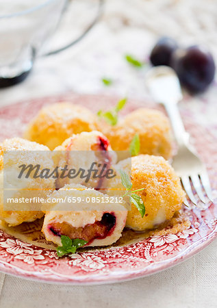 Damson dumplings with buttered crumbs