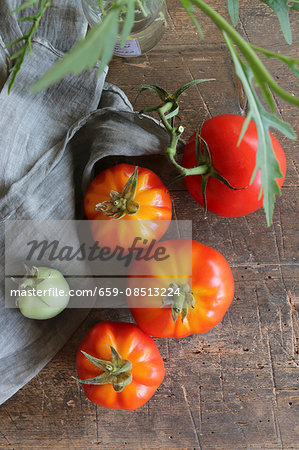 Fresh tomatoes on a rustic wooden table