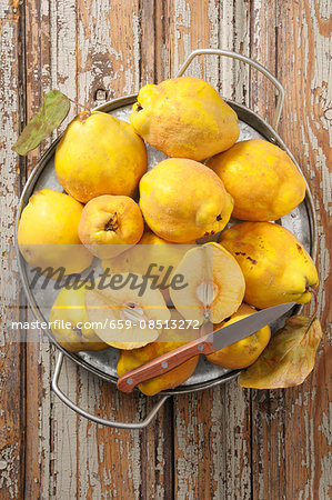 Quinces on a rustic wooden table