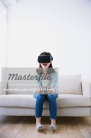 Japanese woman using virtual reality device Japanese woman using virtual reality device