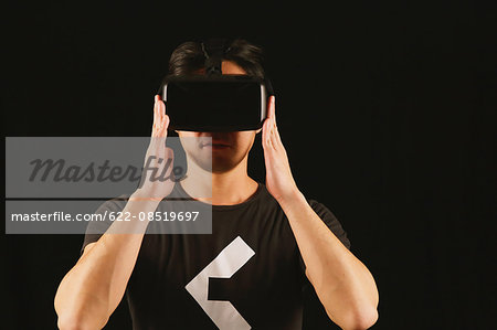 Japanese man using virtual reality device