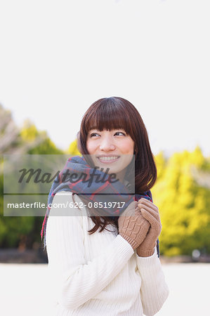 Attractive Japanese woman with muffler on a Winter sunny day
