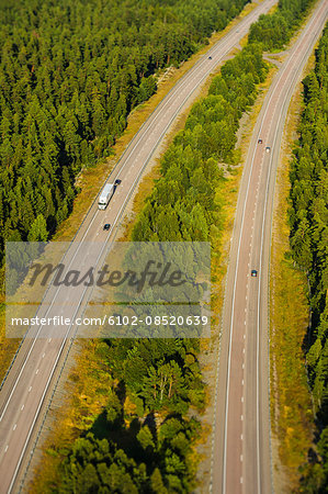 Aerial view of highway in forest