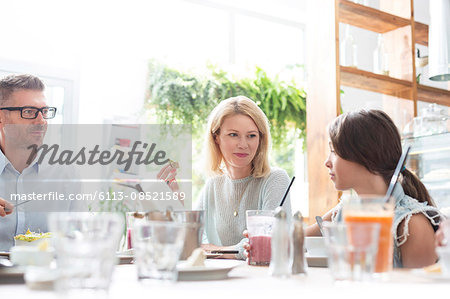 Family eating lunch at cafe table