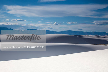 Tranquil white sand dunes and mountains, White Sands, New Mexico, United States Tranquil white sand dunes and mountains, White Sands, New Mexico, United States
