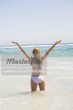 Blonde woman in water at the beach