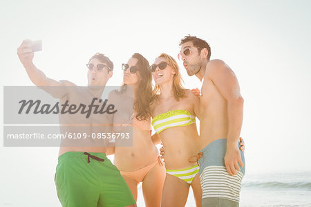 Happy friends taking a selfie