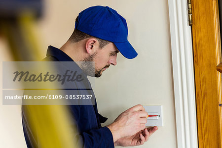 Electrician fixing a door bell