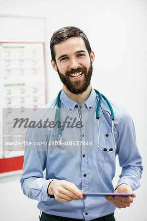 Portrait of doctor using digital tablet