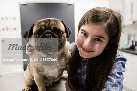 Portrait of girl with her pet dog