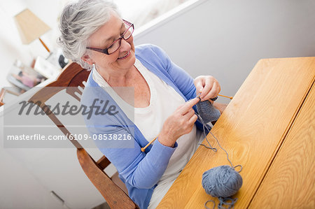 Senior woman knitting